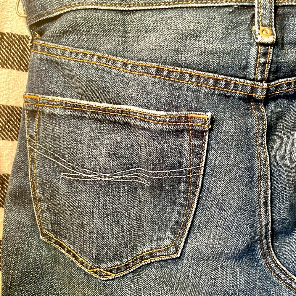 Distressed GAP jean mini skirt. 13” in length size 28/6.
